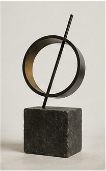 Black cantilevered geometric sculpture supported by a narrow red vertical element.